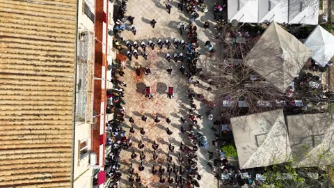 Top Down Aerial of Marching Band and Broken Pots During Easter Holy Saturday in Stock Footage 333819720