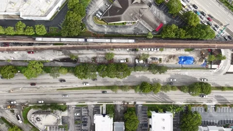 Top-Down Aerial of Metrorail Train Urban Roadway Construction June 25th 2025 Stock Footage 311939768