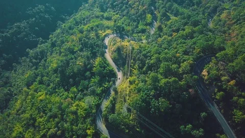 Top Down Aerial Nature View of Scenic Countryside Road Hilly Forest Landscape Stock Footage 104622516