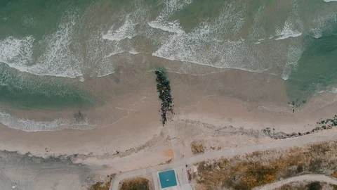 Top Down Aerial of Ocean Rocks and Waves Crashing Stock Footage 94429094