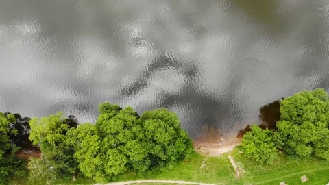 Top Down Aerial, Over Grey Water And green landskape Stock Footage 92465765