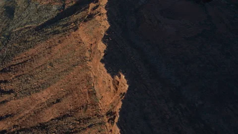 Top down aerial over half shaded red mesa in St George utah desert Stock Footage 264263297