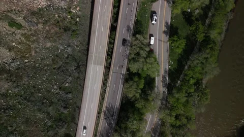 Top down aerial over interstate 70 through Glenwood Canyon Colorado in spring Stock Footage 274079659