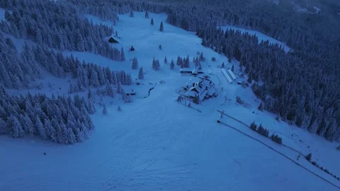 Top down aerial panning of Hala Miziowa mountain chalet in winter Stock Footage 336365707