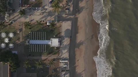 Top Down Aerial Perspective of a Beachside Wedding Ceremony Arrangement on a Видео 335384777