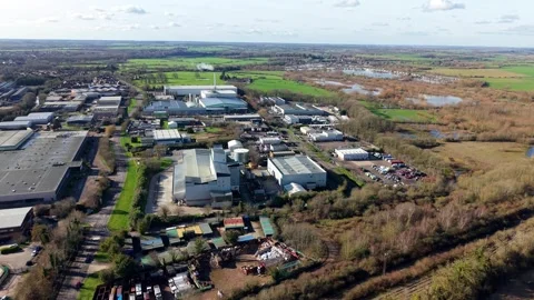 Top down aerial perspective of commercial trading estate units and industrial Stock Footage 338028976