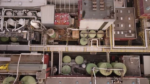Top-down aerial of pipework and tanks at a pulp and paper mill, Austria Video stock 344694266