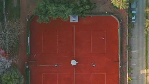 Top Down Aerial of Players Practicing Tennis Match on Clay Court at Araucano Video stock 337629710