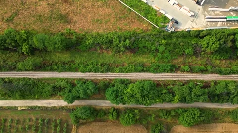 Top Down Aerial of Railway Through Green Vegetation in Bulgaria Stock Footage 341864900