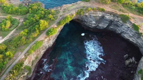 Top Down Aerial Revealing Broken Beach Cove and Arch Nusa Penida Stock Footage 344876455