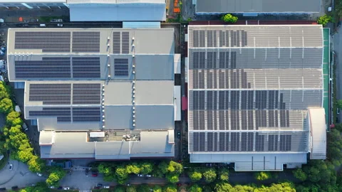 Top Down Aerial Rooftop Solar Panels on Industrial Factory Buildings in Malaysia Stock Footage 328498426