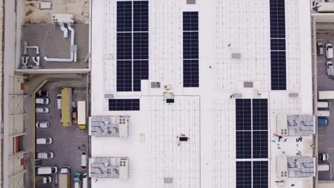 Top down aerial rooftop solar farm under construction Stock Footage 331636130