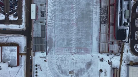 Top down aerial shot of Austin peay football field covered in ice Stock Footage 341928681