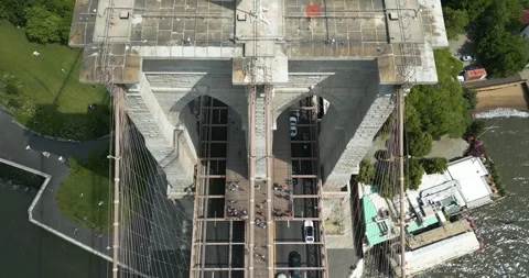 Top-down aerial shot of Brooklyn Bridge over East River in New York City, USA Stock Footage 243707545