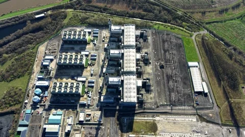 Top down aerial shot of CCGT gas turbine module cooling fan arrays near West Stock Footage 342080649