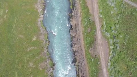 Top down aerial shot of a flowing river in Iceland Stock Footage