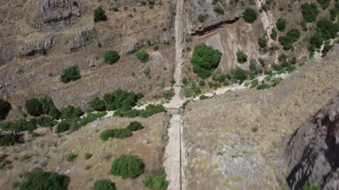 Top down aerial shot of a path splitting. Fork in the road concept. Stock Footage 154753050