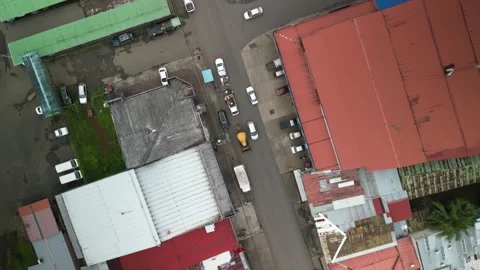 Top down Aerial of small Costa Rican town San Rafael de Guatuso roofs and street Stock Footage 329657564