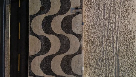 Top down aerial split view of Copacabana beach with patterns in the sand Stock Footage 110901785