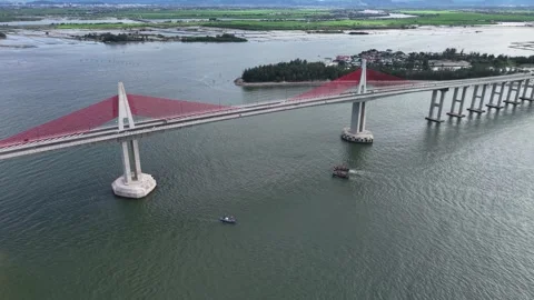 Top-down aerial of Thuan An Bridge spanning lagoon 4K Stock Footage 339861124