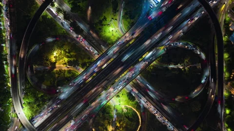 Top-down aerial timelapse of busy highway interchange at night Jakarta Indonesia Stock Footage 344920674