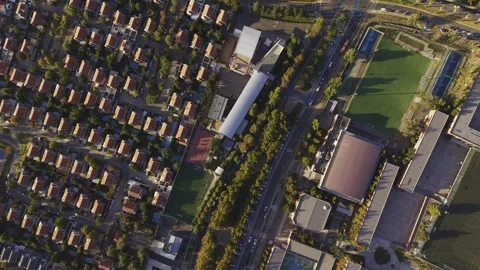 Top-down aerial tracking motion over the roads and residential borders of the Stock Footage 332563851