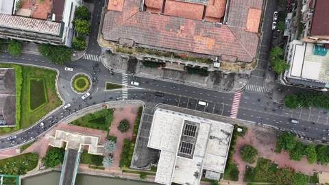 Top down aerial tracking over a roundabout and underpass in Ho Chi Minh City Stock Footage 344906413