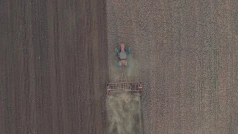 Top Down Aerial Tractor Plowing Field in Rural Oklahoma Farmland Stock Footage 330127327
