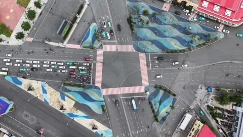 Top down aerial as traffic builds at the Ben Thanh plaza crossing Video stock 344906690