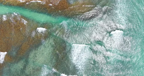 Top Down Aerial of Turquoise Ocean Waves Over Reef and Sandbank Stock Footage 330716765