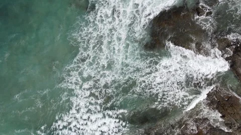 Top down aerial of turquoise ocean waves and foam Stock Footage 336006855