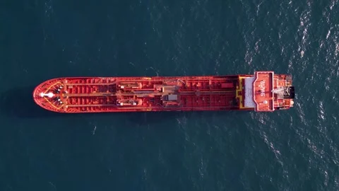 Top-down aerial video of a red oil tanker ship floating in the open sea Stock Footage 317399010