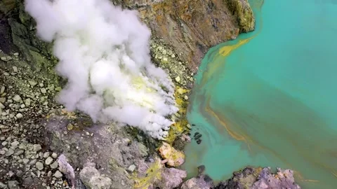 Top Down Aerial View Of Acid Lake Shoreline And Sulfur In Ijen Crater Java Video stock 330763661