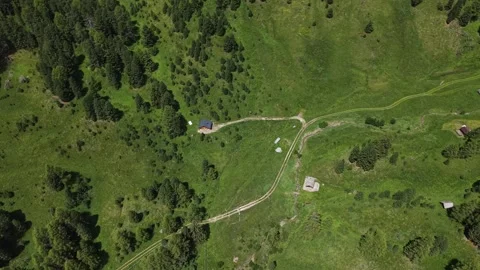 Top Down Aerial View of Alpine Meadow, Trails and Cabins in Dolomites Italy Stock Footage 339886271