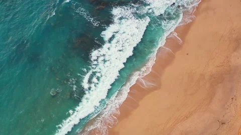 Top down aerial view of Atlantic shoreline with rolling ocean waves Stock Footage 344752056