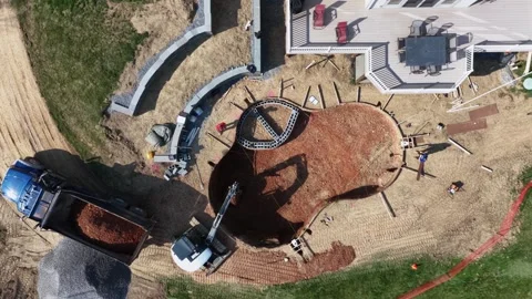 Top-down
aerial view of backyard pool construction at suburban
US home, showing Stock Footage 333880986