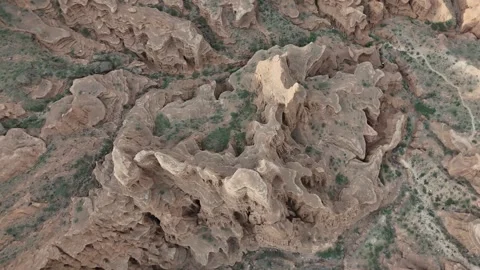 Top-down aerial view of badlands erosion texture, Kok-Moinok Canyons, Kyrgyzstan Видео 347239554