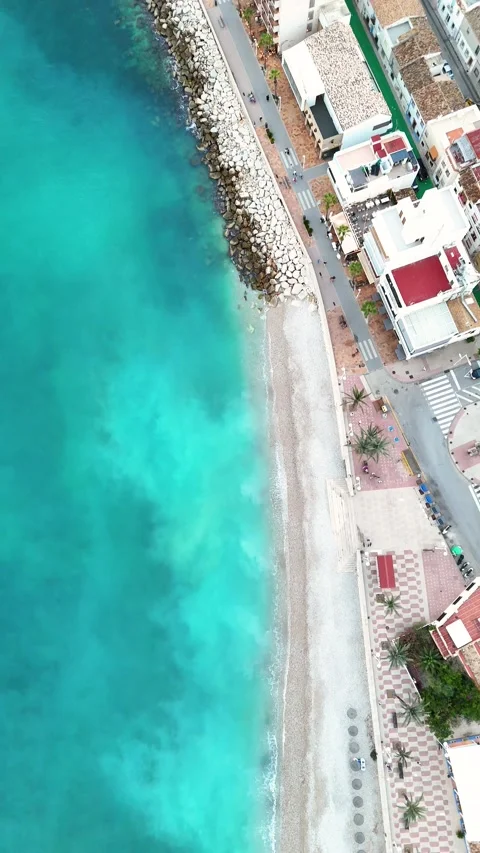 Top down aerial view of beach promenade and turquoise sea, Javea, Spain Stock Footage 339989892