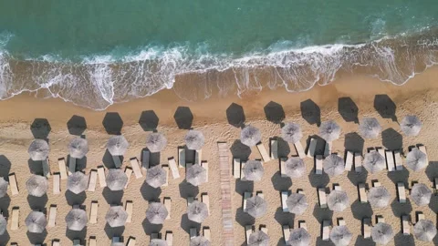 Top Down Aerial View of Beach Umbrellas on Sandy Coast and Sea 스톡 동영상 340391558