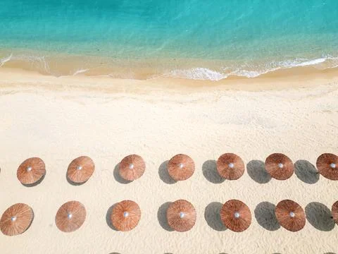 Top Down Aerial View of Beach Umbrellas on Sandy Coast and Sea Stock Photos