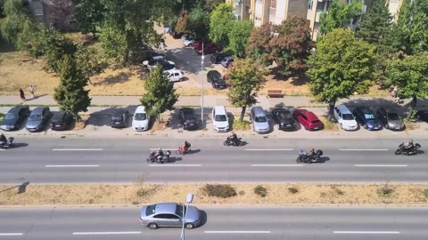 Top-Down Aerial View Of Bikers Riding With Police Escort On City Street Видео 328296545
