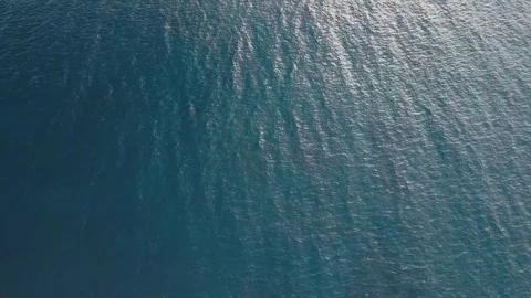 Top down aerial view of blue ocean. Water surface clean texture background Stock Footage