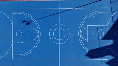 Top down aerial view of blue basketball court 스톡 동영상 330052222