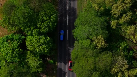 Top Down Aerial View of Blue Car Driving on Rural Road 库存影片 334673584