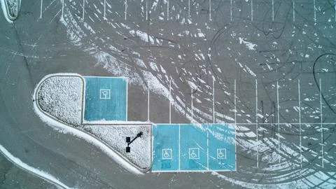 Top Down Aerial View of Blue Accessible Parking and Burnout Tire Tracks in Sn Stock Photos