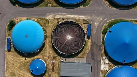 Top Down Aerial View of Blue Biogas Digesters and Open Tank Stock Photos