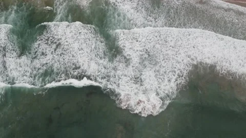 Top down aerial view of breaking ocean waves Stock Footage 336020505
