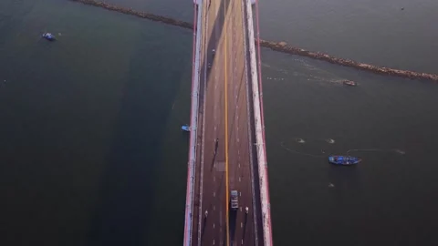 Top down aerial view of bridge crossing calm coastal waters Stock Footage 340875166
