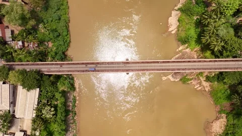 Top Down Aerial View of Bridge Over Brown River With Rapids, Luang Prabang Stock-Footage 347422170