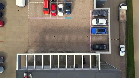 Top down aerial view of building and cars Stock Footage 297089820